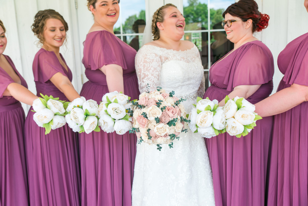 bride and bridesmaids holding bouquets at Meadowview Wedding and Event Venue