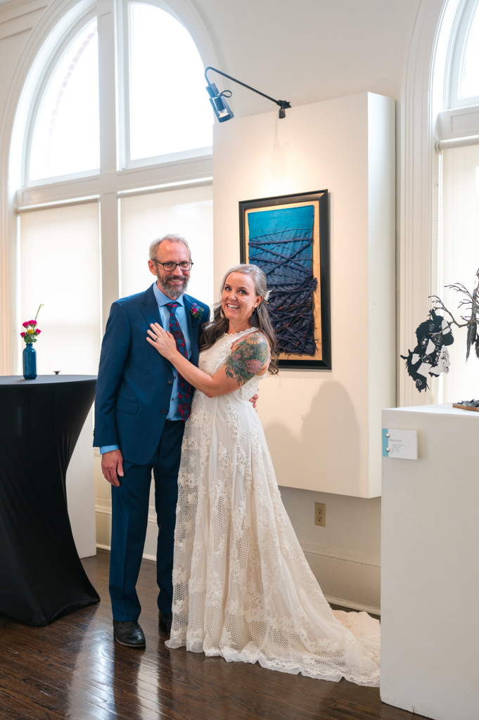 Bride and Groom in art gallery