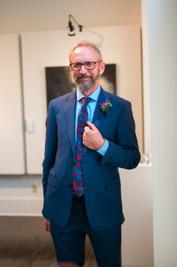 Groom standing in art gallery