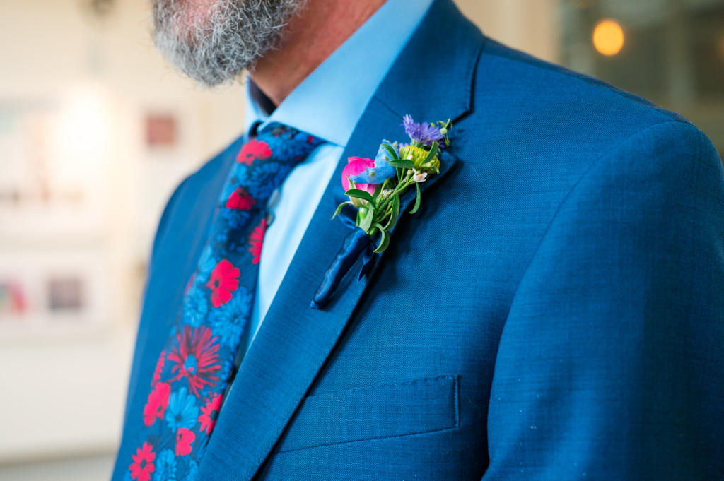 Groom's boutonniere in art gallery