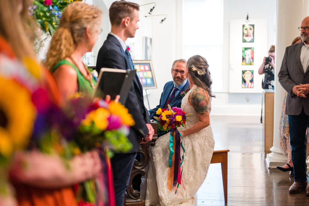 Bride and Groom sitting at piano