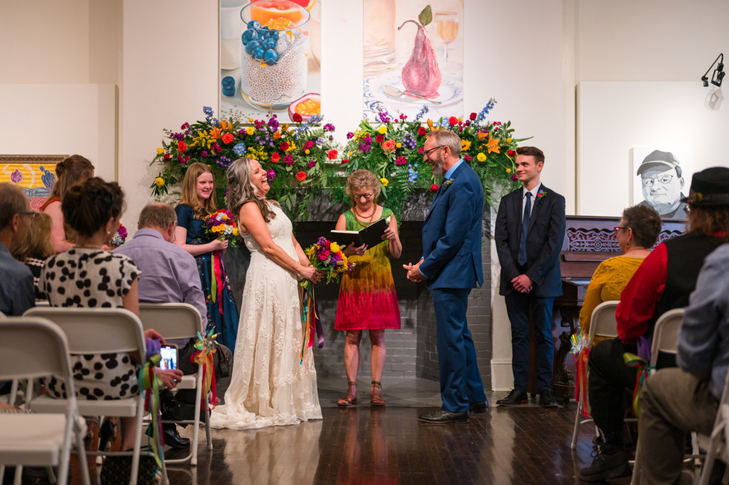 bride and groom in art gallery