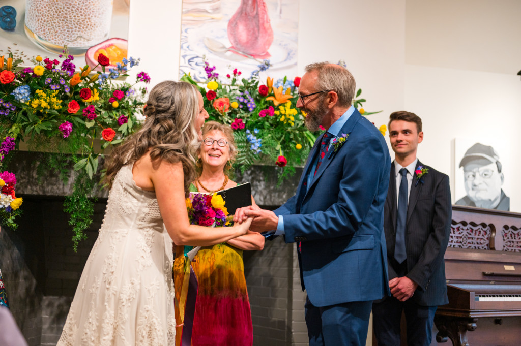 Bride and groom holding hands