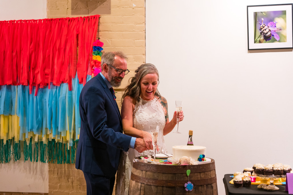 bride and groom cutting cake