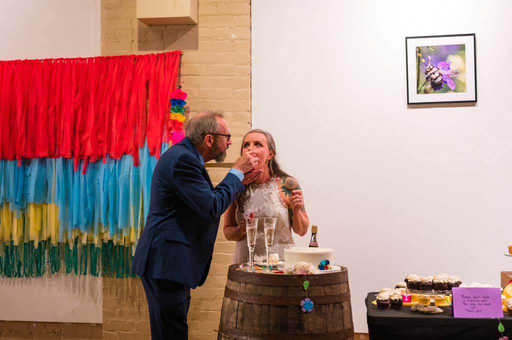 bride and groom eating cake