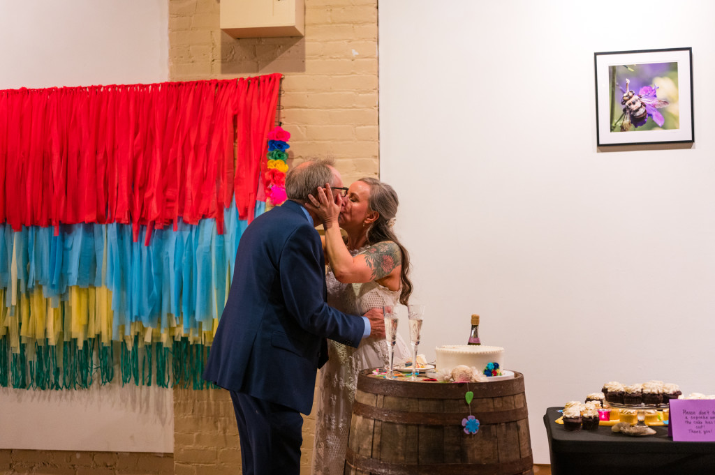 bride and groom kissing in ArtsPlace