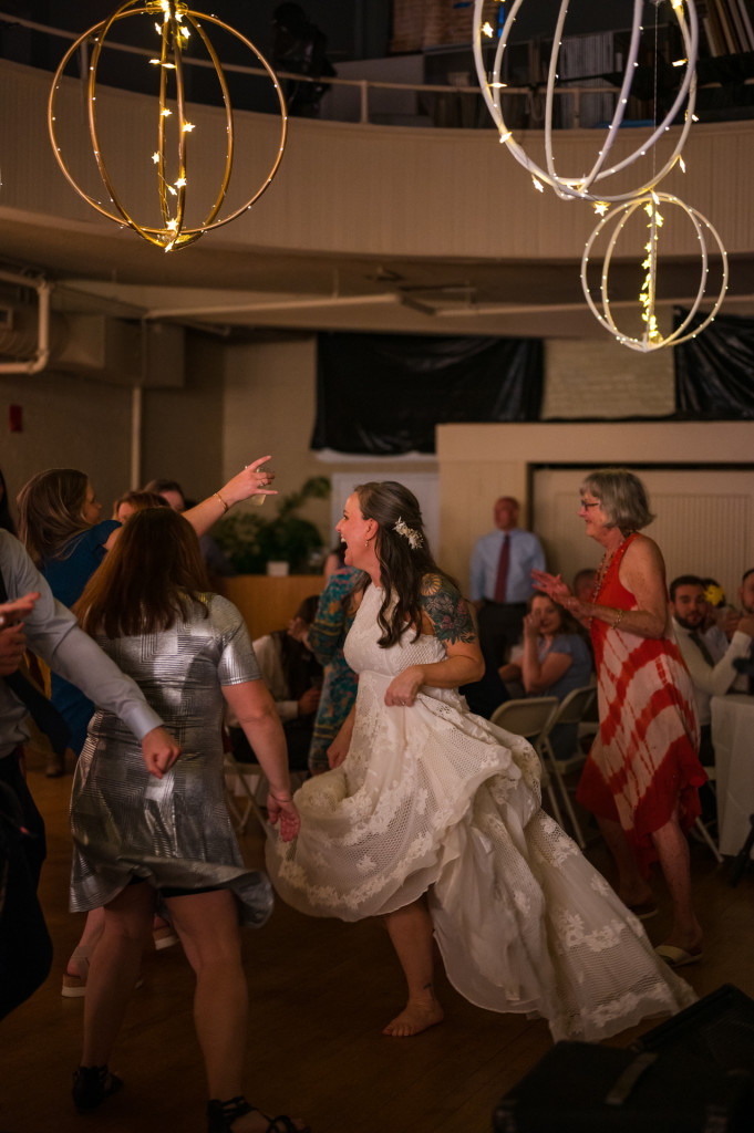 Bride and guests dancing